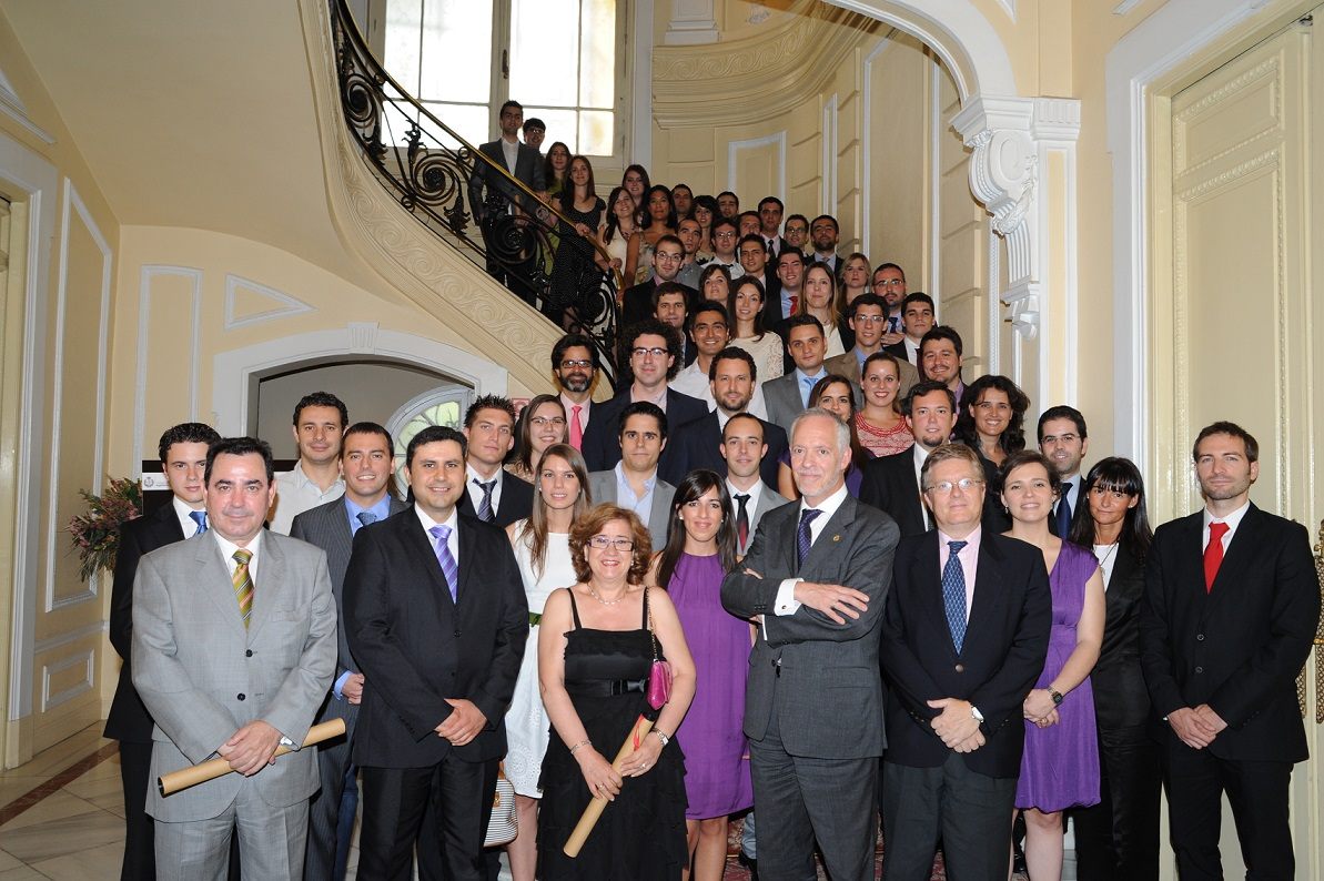 Large graduation group photo on a grand staircase