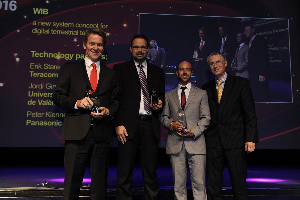 Award winners on stage at the IBC 2016 ceremony, with the WiB paper on the screen